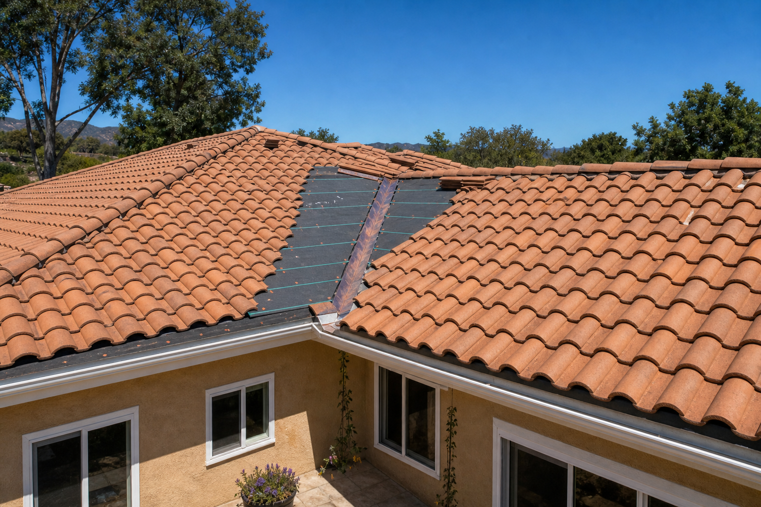 Terracotta tile roofline tie-in where the addition meets the existing home