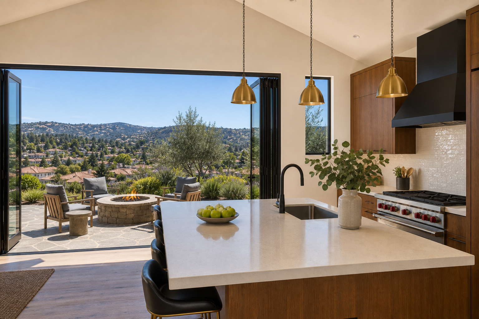 Kitchen island view toward open glass doors, fire pit, and populated suburban hillside neighborhood